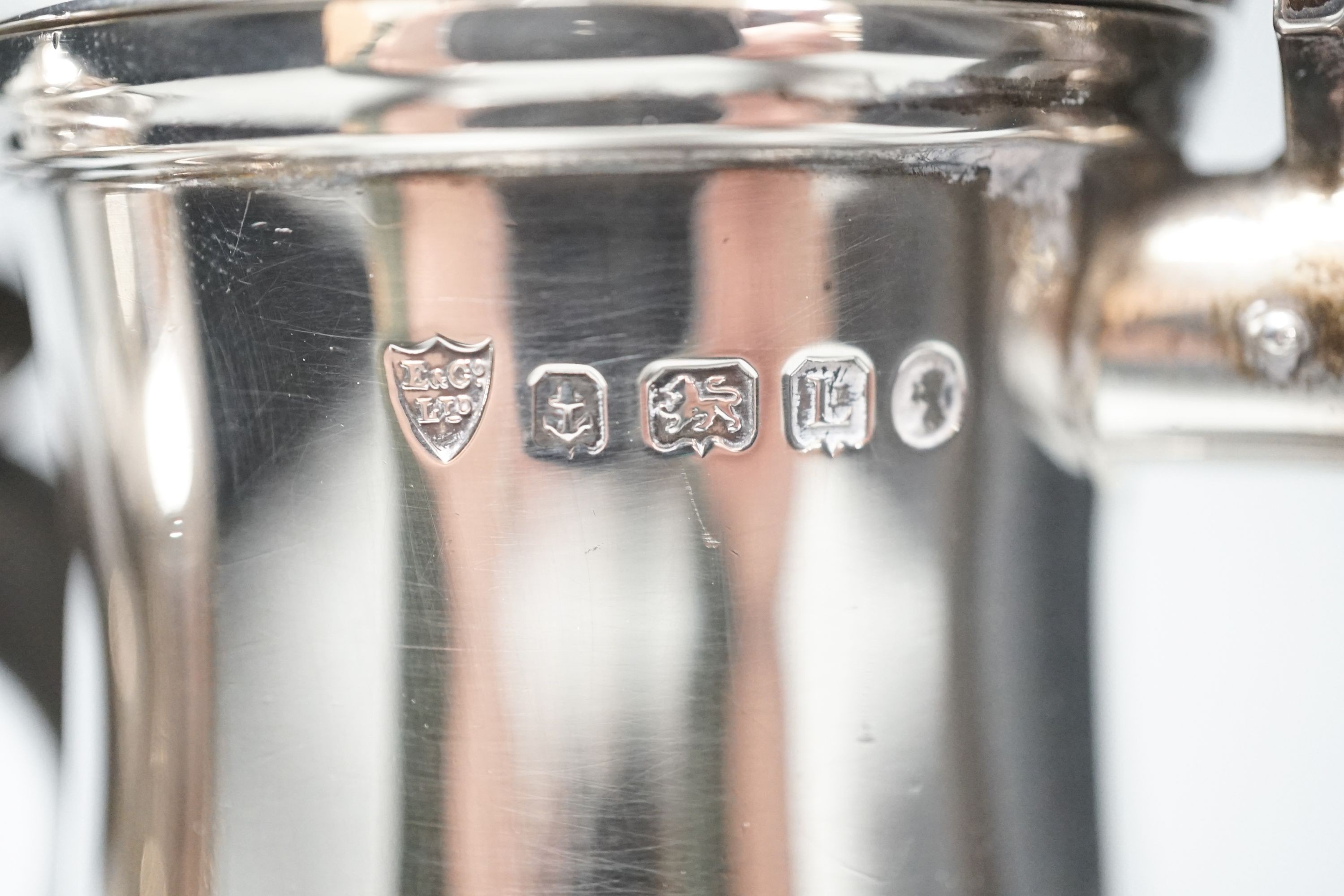 A 1930's silver coffee pot and a similar silver how water pot, Birmingham, 1934 & 1935, gross 39oz.